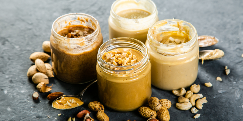 nut butter with nuts in jars