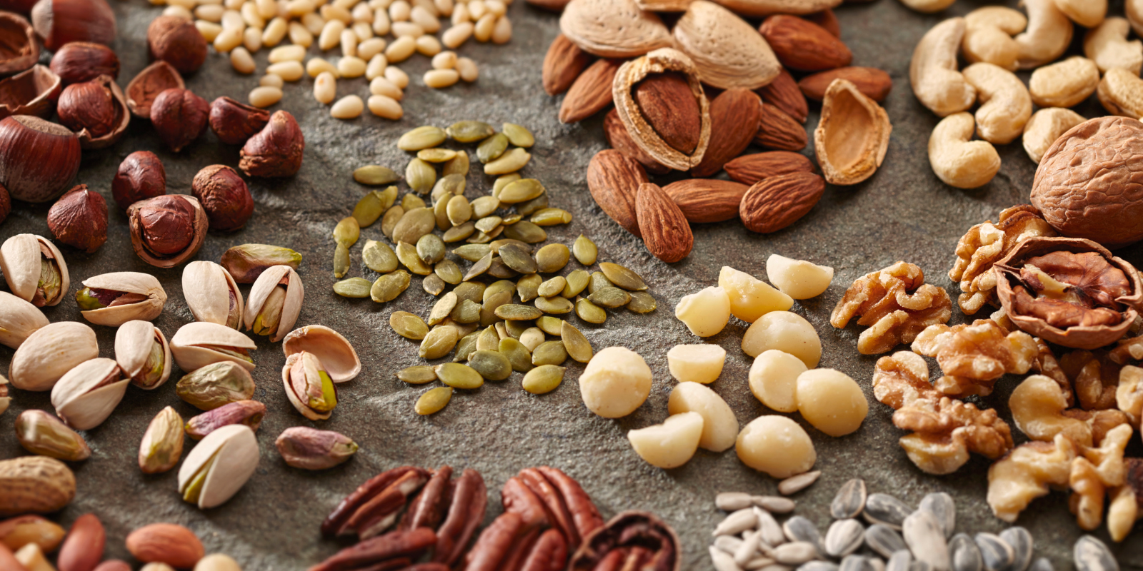 nuts and seeds on a board