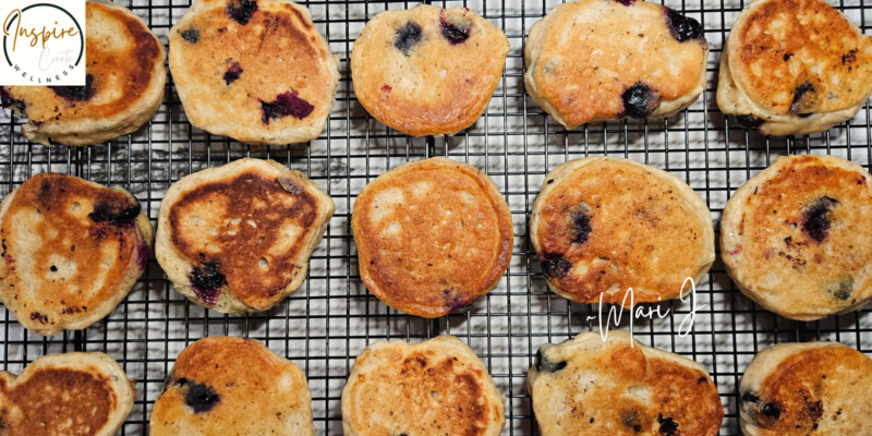 Blueberry Kefir Pancakes on a cooling rack.