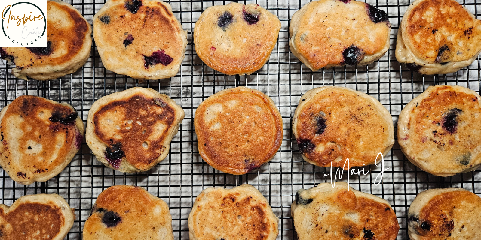 Blueberry Kefir Pancakes on a cooling rack.